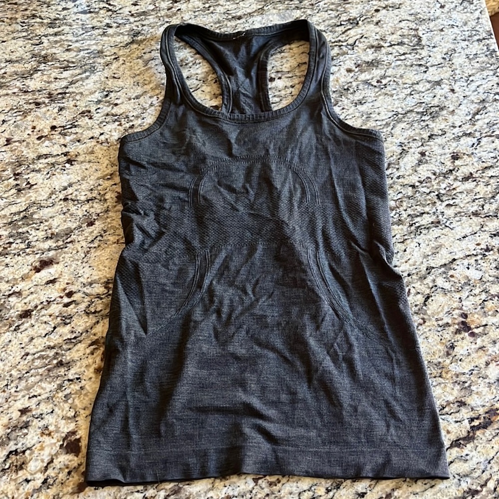Dark green Lululemon razor back tank.